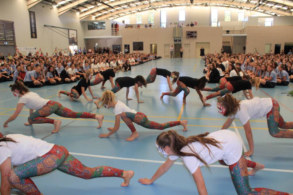 PEACE DANCE: Students at James Sheahan Catholic High School perform at a Harmony Day assembly.