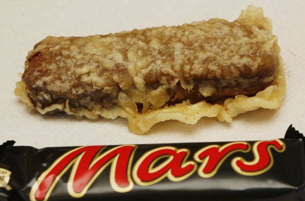 OUT OF THIS WORLD: Eating a battered Mars bar is definitely an adventure. Photo: CONTRIBUTED