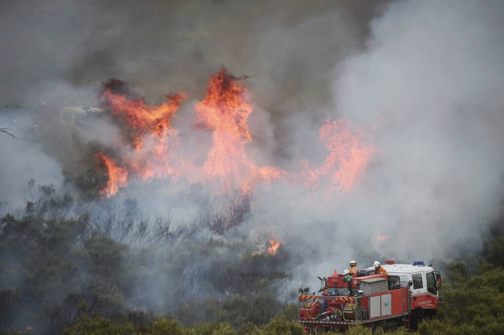 AT ITS PEAK: NSW RFS crews battle the Gowan blaze. Photo: NICK MOIR