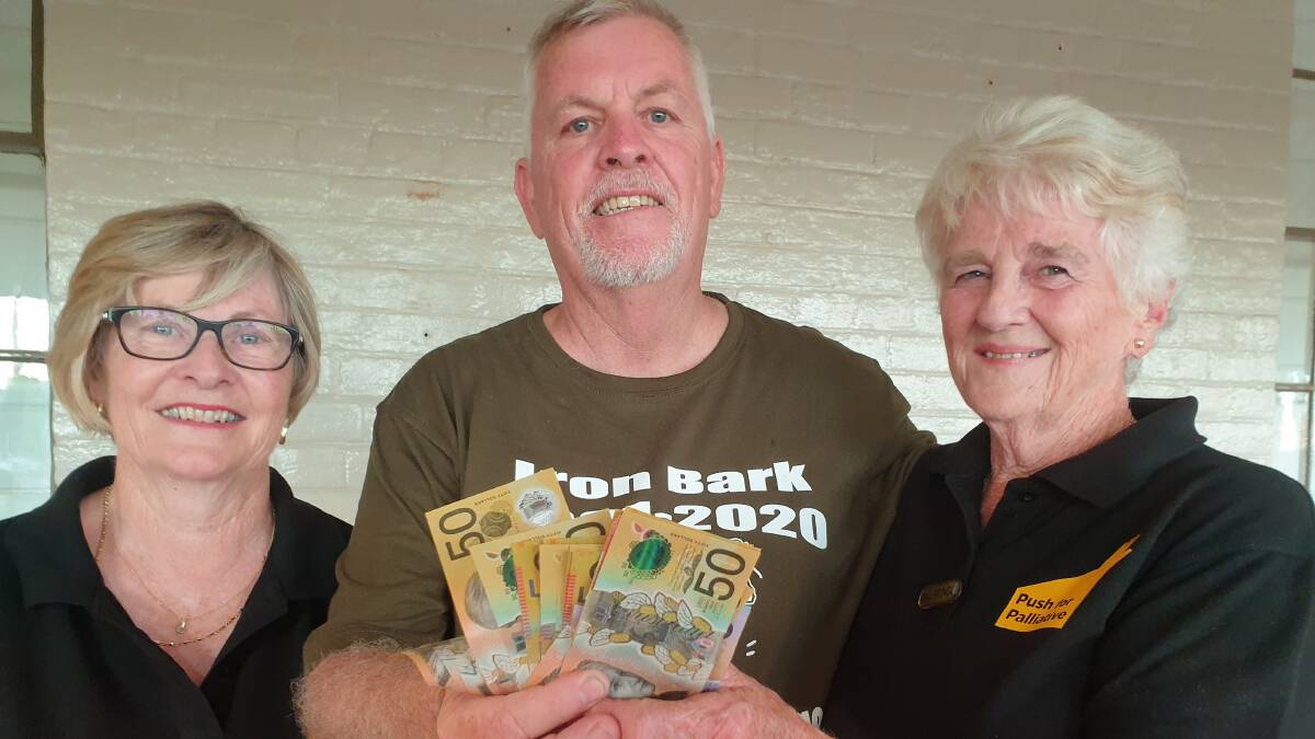 Iron Bark riders representative Bill Eyles presents a donation to Marg West and Gail Pringle from Orange Push for Palliative: PHOTO: Janice Harris
