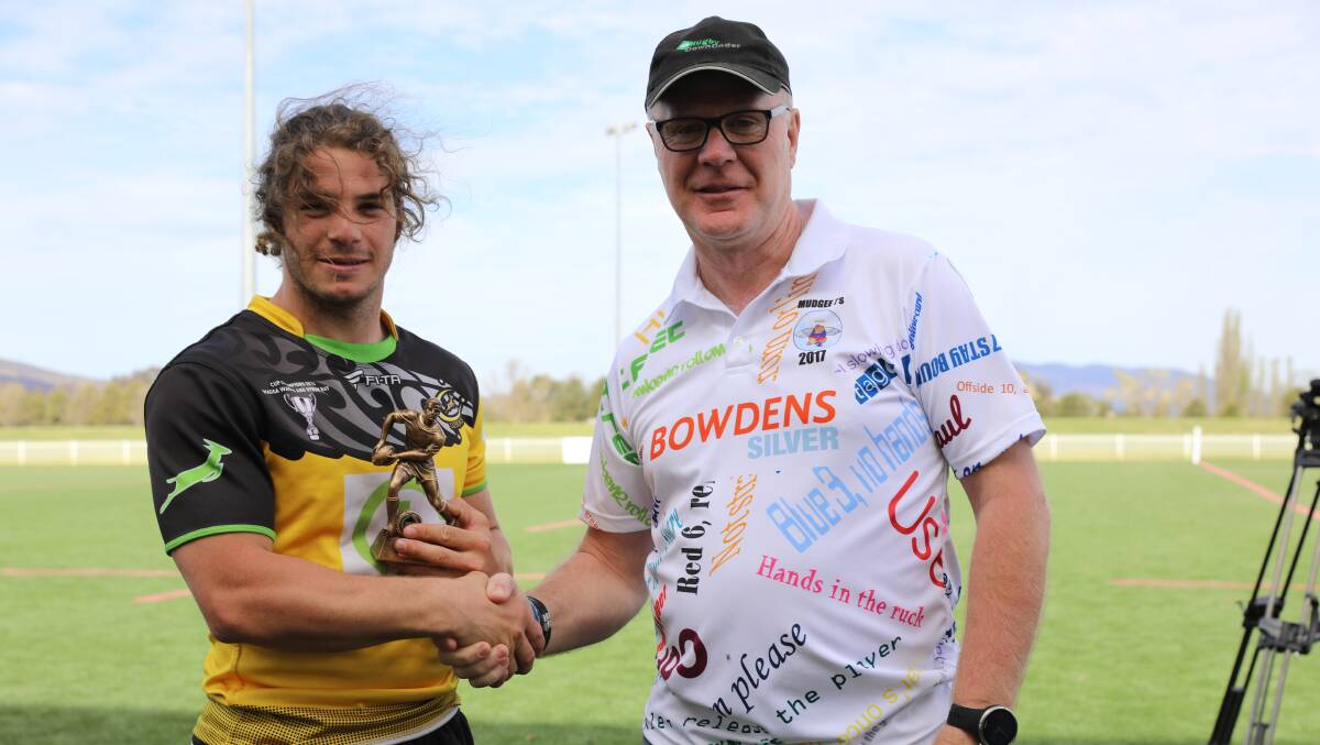 TOP NOTCH: Player of the tournament Donny Durant, pictured with referee Simon Brown. Photo: Simone Kurtz