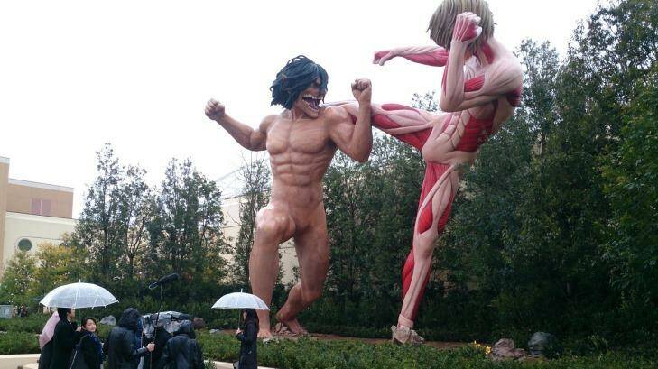 Two Titans battle it out outside Attack on Titan: The Real at Universal Studios Japan attraction. Photo: Tim Biggs