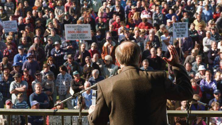 gun: 960616: rally at Sale: pic Colin Murty: The Age general news: P.M.  JOHN HOWARD ADDRESSES RALLY AT SALE ABOUT THE GUN ISSUE.   Note - John Howard is wearing a bullet-proof vest under his jacket.

Image used;  The Age - Reflections: 150 Years of History, pg 53.