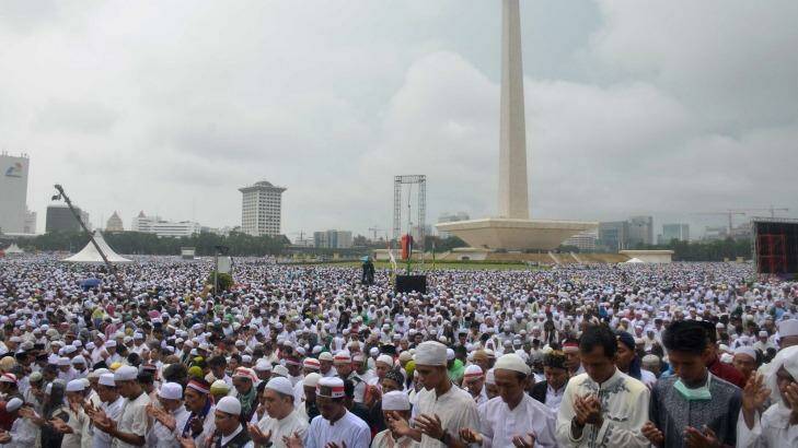 Tens of thousands take part in a prayer at Jakarta's National Monument during the December 2 rally against Jakarta's governor Ahok. Photo: Dewi Nurcahyani