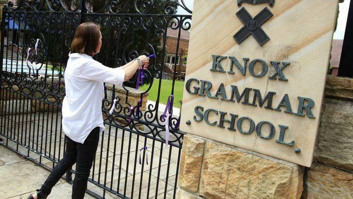 Ribbons being tied to the gate of Knox Grammar School. Photo: Ben Rushton