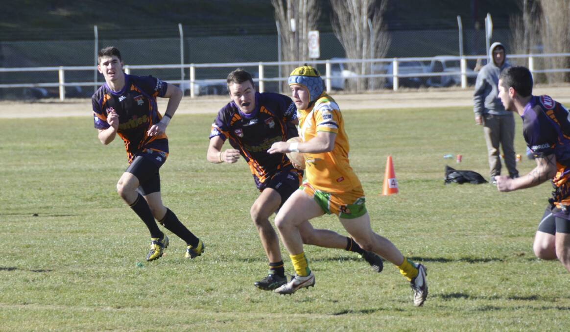 SHOCK LOSS: Orange CYMS hooker Sam Hill makes a break in his side s 26-point loss to Lithgow Workies on Sunday. Photo: JEFF GEDDES