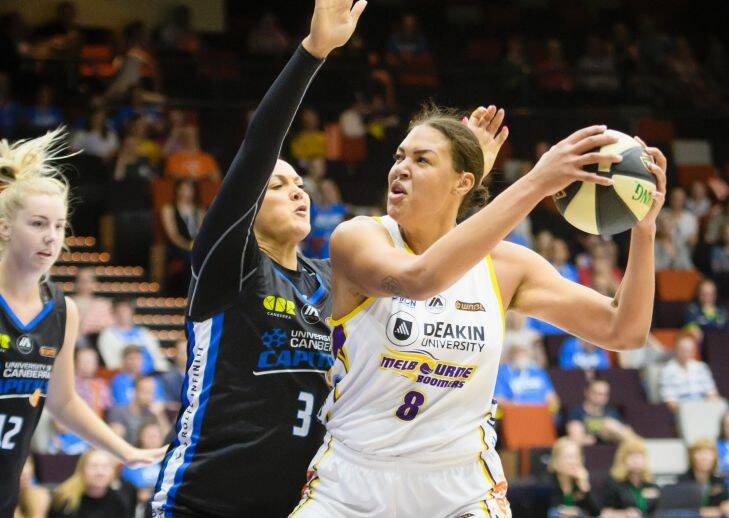 Capitals forward Mistie Bass tries to defend against Boomers centre Liz Cambage. Photo: Sitthixay Ditthavong