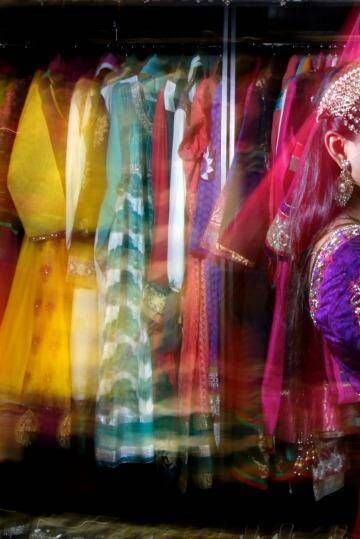 Shaleen Kumar tries on saris at Dulhan Exclusives in Liverpool, Sydney. Photo: Janie Barrett