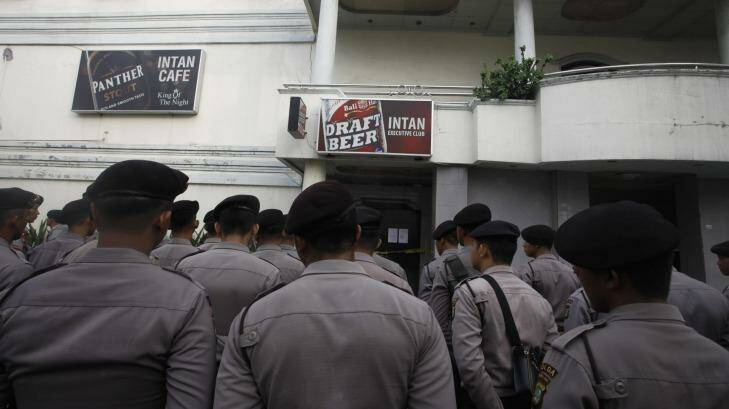 Indonesian police outside a 'cafe' in Kalijodo. Photo: Irwin Fedriansyah