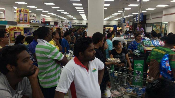 People queue in a supermarket in Suva ahead of cyclone Winston's landfall.  Photo: Alice Clements
