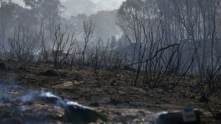 Smouldering remains of a property after a fire at Carwoola, southeast of Canberra.  Photo: Alex Ellinghausen