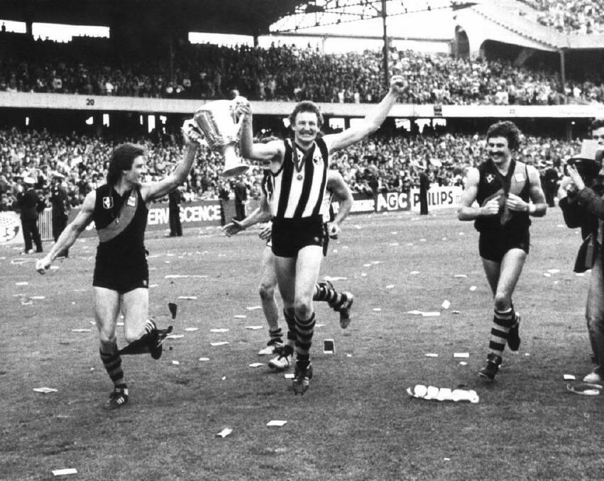 Richmond players Geoff Raines, Michael Roach (wearing a Collingwood guernsey) and Mick Malthouse after their grand final series win in 1980.  Photo: Supplied