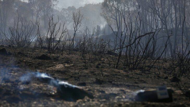 Smouldering remains of a property after a fire at Carwoola, southeast of Canberra on Friday 17 February 2017. fedpol Photo: Alex Ellinghausen