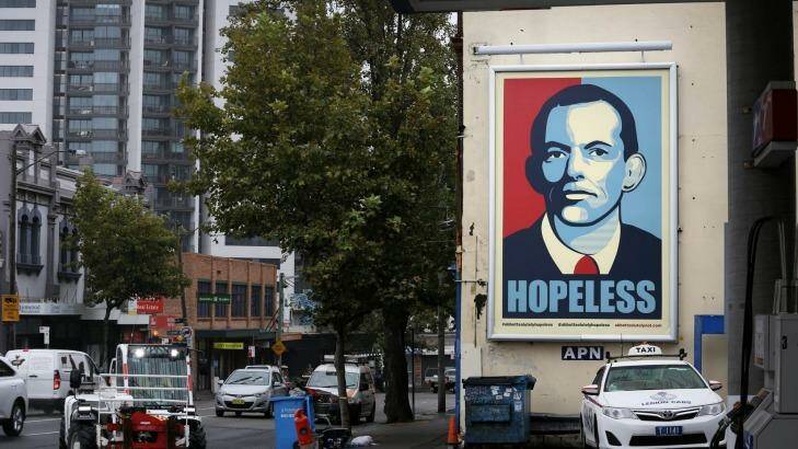 A Tony Abbott ''hopeless'' poster at a service station in Sydney. Photo: Brianne Makin