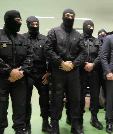 Tony Abbott poses with members of French counter-terrorism unit RAID. Photo: Nick Miller