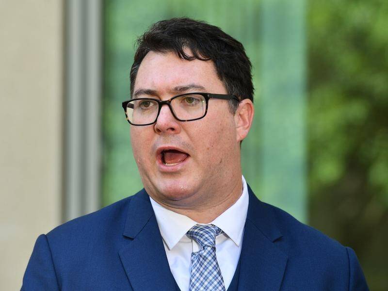 Nationals MP George Christensen is under fire over a tweet he posted with him holding a gun.