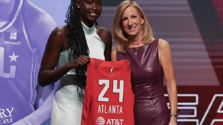 Australia's Nyadiew Puoch (l) poses with WNBA commissioner Cathy Engelbert at the draft. (AP PHOTO)
