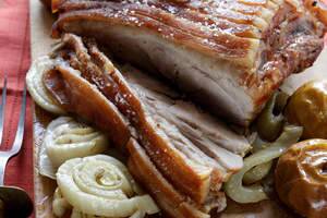 Slow-roast shoulder of pork with fennel and apples. Photo: Marina Oliphant