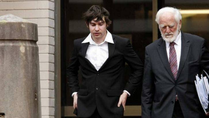 Liam Johnson, left, leaving Newcastle Courthouse on Monday.  Photo: Max Mason-Hubers