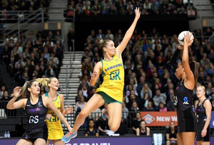 Courtney Bruce of Australia, centre, defends against Maria Tutaia of New Zealand in the netball Constellation Cup between the New Zealand Silver Ferns and Australian Diamonds, Horncastle Arena, Christchurch, New Zealand, October 8, 2017  (AAP Image/SNPA, Adam Binns) NO ARCHIVING, EDITORIAL USE ONLY