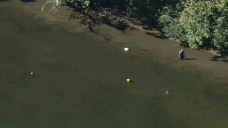 Police are searching for a vehicle with a child inside which has been submerged in the Hawkesbury River.  Photo: Nine News