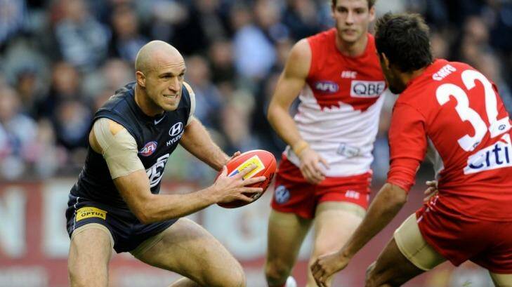 Big shoes: Chris Judd's career includes stellar performances against Sydney in 2010 and 2011.  Photo: Sebastian Costanzo
