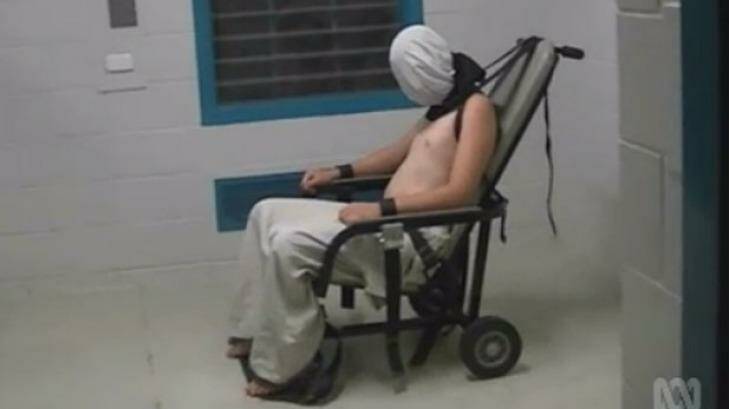 An image from the Four Corners program showing a teenage boy strapped to a mechanical chair in an Alice Springs prison. Photo: ABC Four Corners