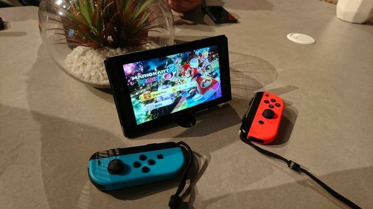 When detached from the console, the Joy-Con can be fitted with straps that make them comfier to hold and stop you accidentally flinging them away. Photo: Tim Biggs