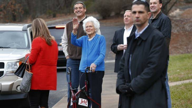 Barbara Bush waves goodbye to her son outside a polling place in Greenville, South Carolina. Her return to the campaign trail exposed her and her son to ridicule. Photo: Paul Sancya
