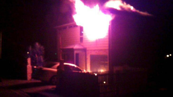 Katie Foreman's house on fire, seen in a screen grab from a video.