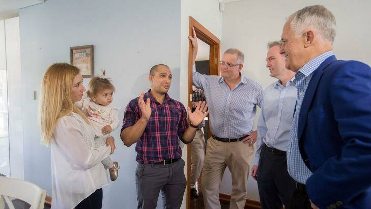 Kim and Julian Mignacca and 11-month-old daughter Addison talk to Malcolm Turnbull, Scott Morrison and local MP David Coleman about their home in Penshurst in suburban Sydney. Photo: Michele Mossop