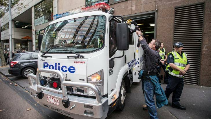 A police van carrying five alleged terror suspects arrives at the Melbourne Magistrates Court on Thursday Photo: Jason South