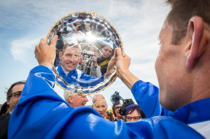 28/10/17 Winx jockey Hugh Bowman celebrates after he led Winx to her 3rd Cox Plate at the 2017 Cox Plate, Moonee Valley. Photograph by Chris Hopkins