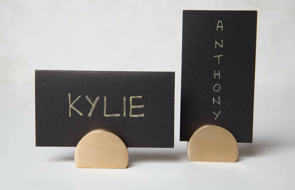 Assigned seating is a good thing at a dinner party. Direct funny people to the middle of the table and shy ones near the host. Brass card holders, $29.95, kikki-k.com. Photo: Supplied