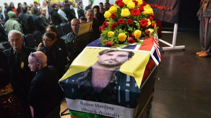 Reece's coffin was draped with both the Kurdish and Australian flags. Picture by JOE ARMAO