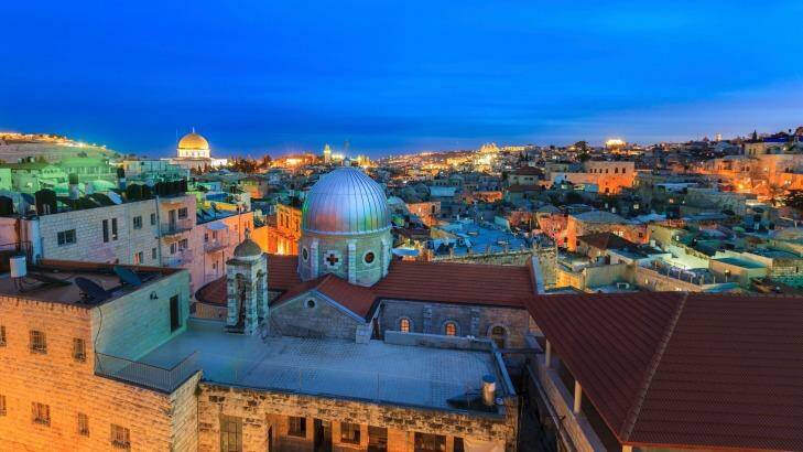 Jerusalem at dusk, with armenian catholic church "Our Lady of the Spasm" and the the Dome of the Rock in the back Photo: fredfroese