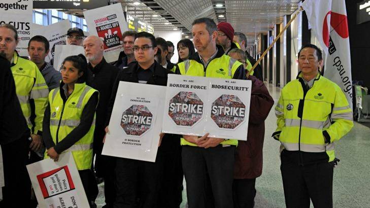 Workers at Melbourne Airprot stop work amid an industrial campaign for better pay. Photo: Joe Armao