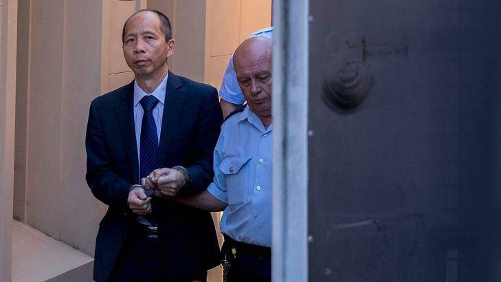 Robert Xie is led away after he was sentenced this week. Photo: Michele Mossop