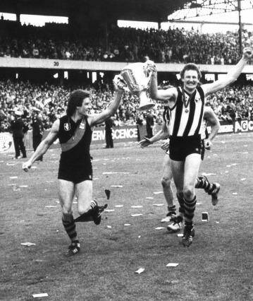 Richmond players Geoff Raines, Michael Roach (wearing a Collingwood guernsey) and Mick Malthouse after their grand final series win in 1980.  Photo: Supplied