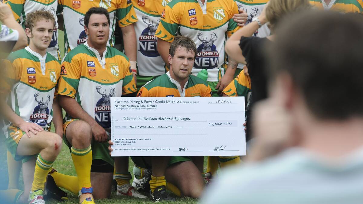 WINNERS ARE GRINNERS: Orange CYMS first division captain Nick Law (front) with his side's winners cheque following the 12-nil victory over Blayney.