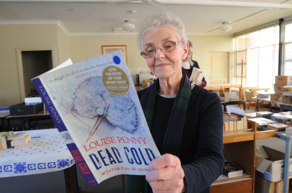 BOOK FAIR: Margaret Williams will be manning the book fair at St John’s Uniting Church today and tomorrow. Photo: STEVE GOSCH 0515sgbooks2