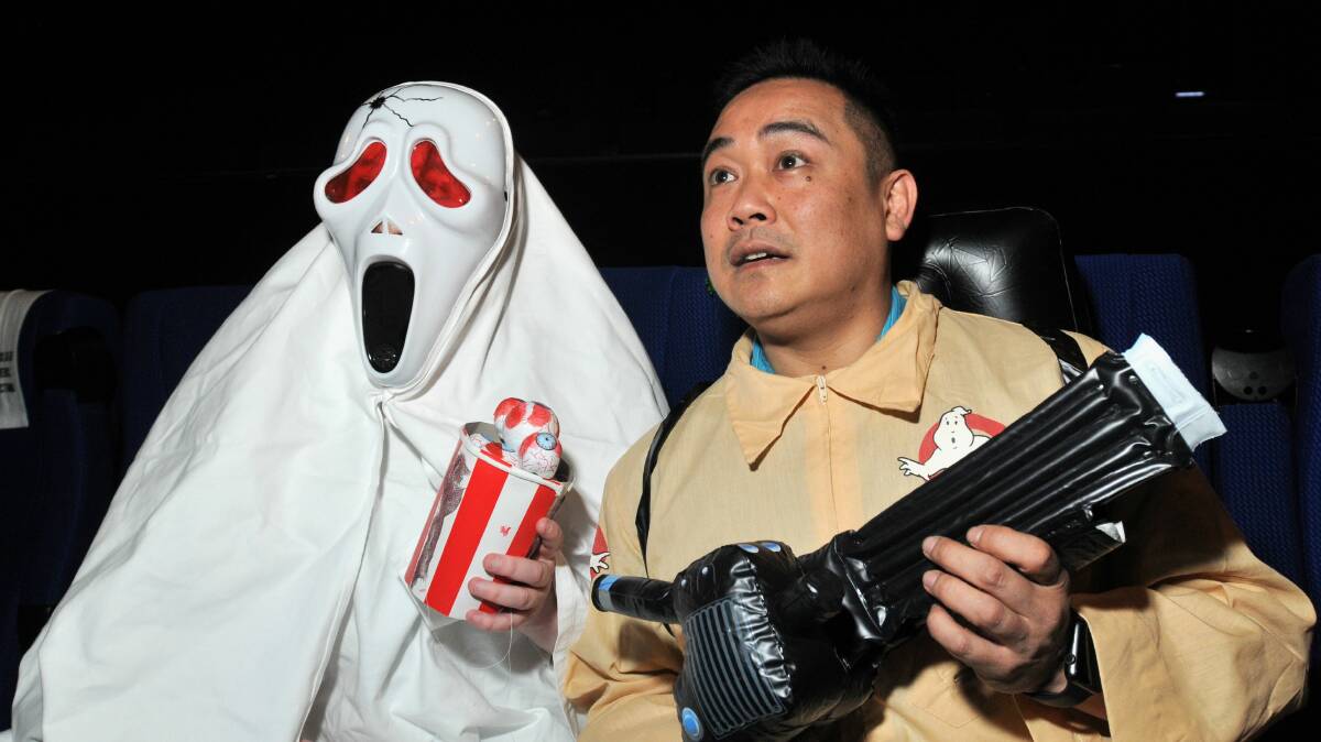 SOMETHIN’ WEIRD IN YOUR NEIGHBOURHOOD: Megan While and Orange Film Society publicity officer Peter Young encourage cinema buffs to come along to a special screening of Ghostbusters for the 30th anniversary of its release. Photo: STEVE GOSCH  1002sgghost1
