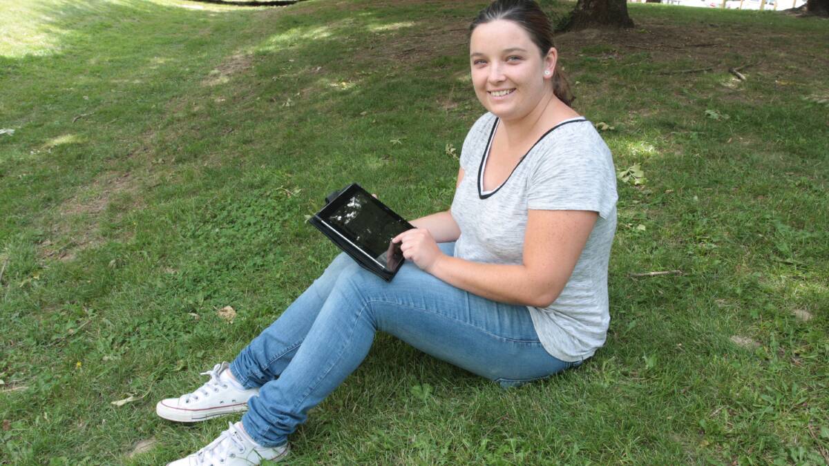 PORTABLE STUDENT: Jade Charnock uses an iPad to access the Virtual Student Hub at TAFE’s Orange campus. Photo: STEVE GOSCH