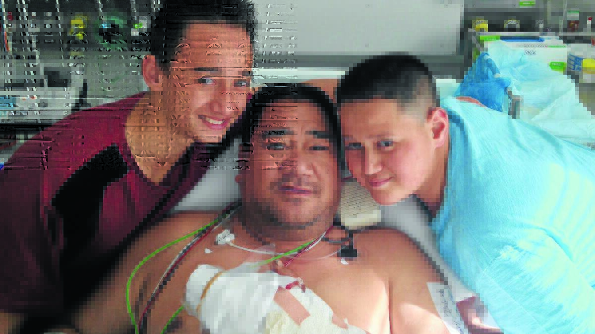 HEROES: Bathurst man Henry Mahara, with his sons Nicolas and Preston, in Westmead Hospital, where he had two fingers re-attached after a woodchopping accident.