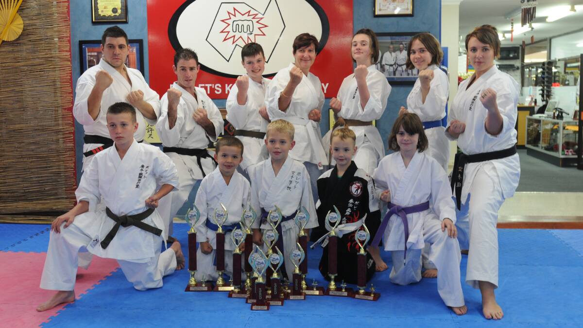 WINNING: The Pollet's Martial Arts crew from Orange that cleaned up at the ISKA NSW Open, (back, left) sensei Nick Eid, sempai Brayden Dodd, Ben Puxty, Nichole Puxty, Jessica Puxty, Alex Shields, sensei Emma Gavin (front, left) Harry Puxty, Cooper Lawry, Connor Shields, Sylas Henderson and Sarah Wright.
Photo: STEVE GOSCH 0409sgpollets