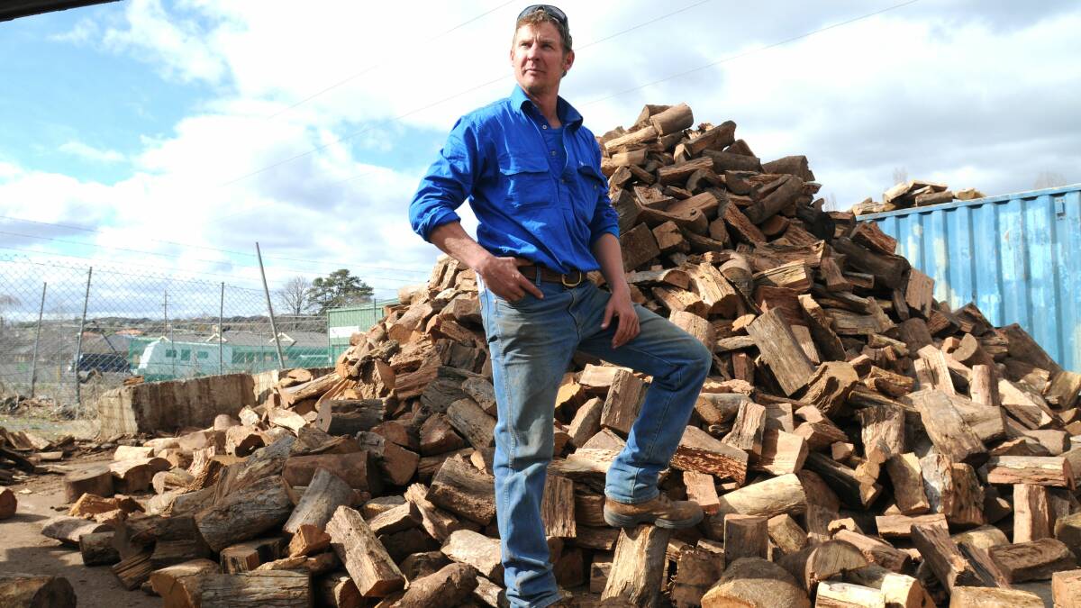 RISING SALES: I've Got Wood owner Scott Petersen says more people are returning to wood heating. Photo: STEVE GOSCH 0827sgwood2