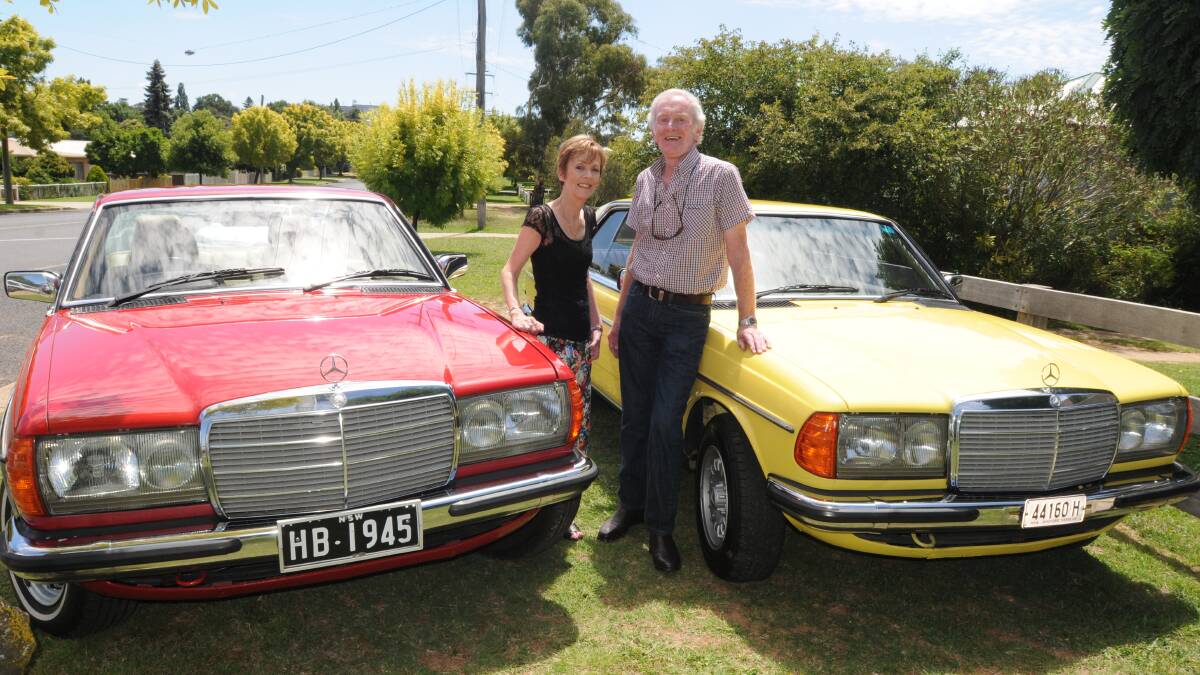 FULL THROTTLE: Ann Hailes and Steve McGinley with their 1981 Mercedes 280 CE and their 1984 280 CE. Photo: JUDE KEOGH