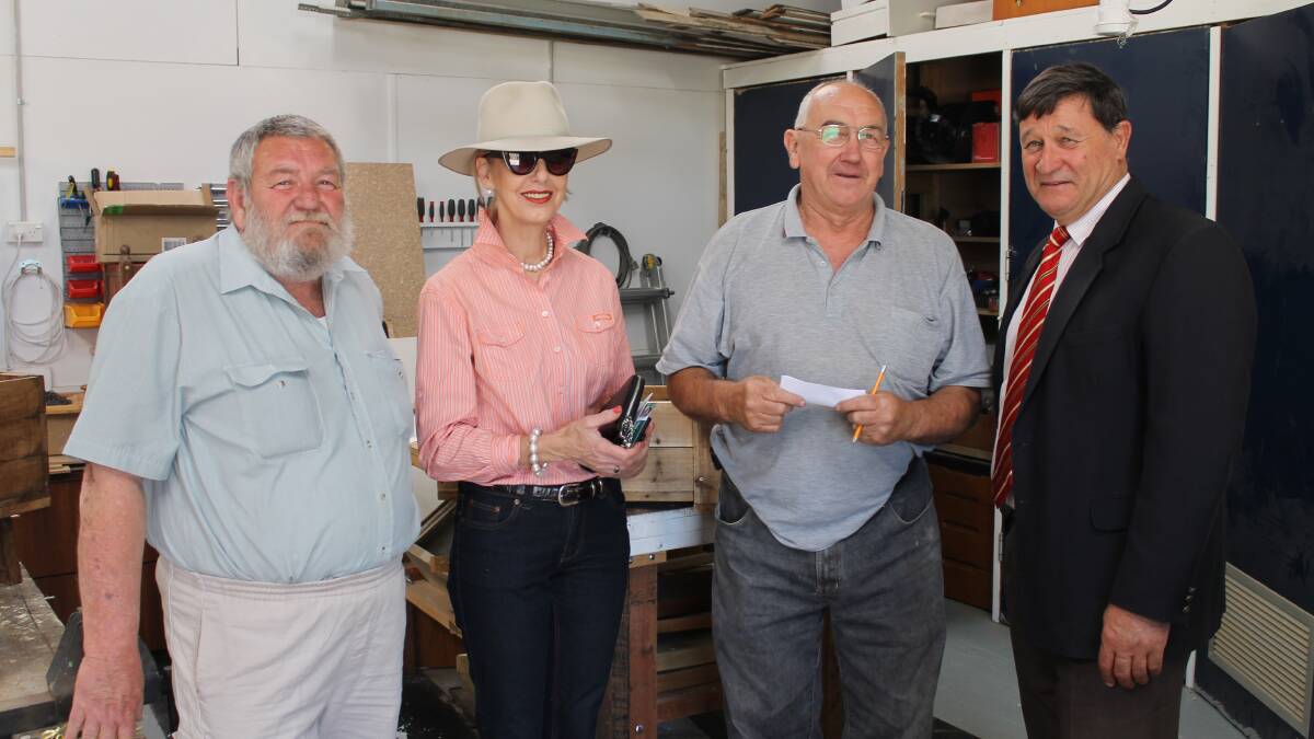 Bob Alliston, Maree Statham and Allam Armour accept a donation from member for Calare John Cobb. Photo: CONTRIBUTED 