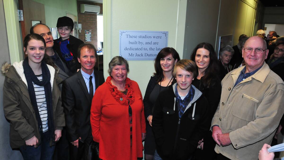 FOREVER REMEMBERED: Charlotte Gorman, Nic and Samuel Pyke, Greg Dutton, Alison Dutton, Janet Dutton, Oliver Dutton, Sally Pyke and Dick Dutton unveil a plaque in honour of Jack Dutton's efforts at the Orange Regional Conservatorium. Photo: JUDE KEOGH  0627orc6