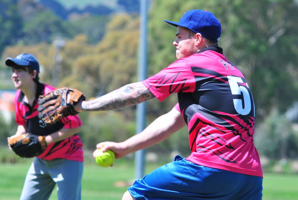 GRAND FINALIST: Wannabies pitcher Ben Warner is expecting a tight grand final today against the Titans. Photo: JUDE KEOGH 0309softball1